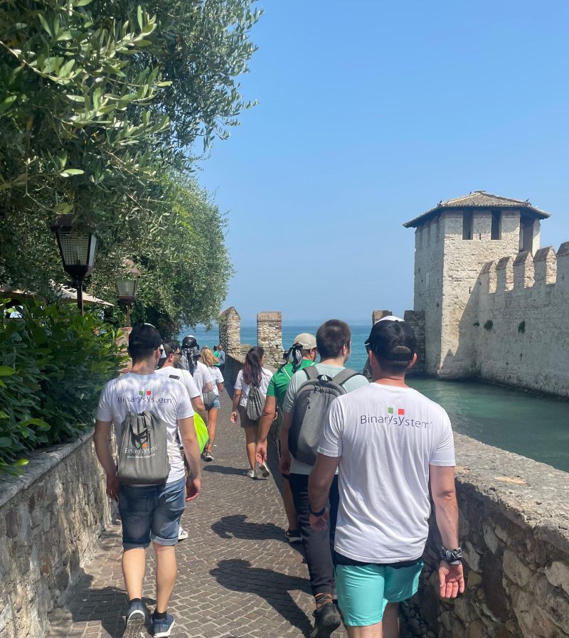 one the teams walking in Sirmione during the Binary System team building 2025.